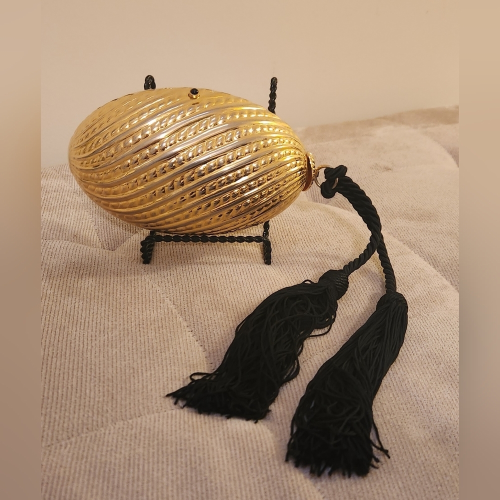 Saks Fifth Avenue Minaudiere'  gold evening bag with black tassel Made in Italy.